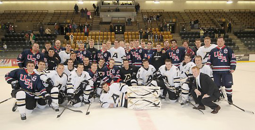 The USA Warriors Hockey team poses with Army players after a game in December 2010. (USA Warriors Hockey)