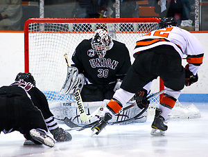 Goaltender Keith Kinkaid (Union - 30) makes a save on Kevin Lohry (Princeton - 12). Kinkaid made 28 saves as the Union College Dutchman visited Hobey Baker Rink in Princeton, NJ, defeating Princeton 7-4. (Shelley M. Szwast)