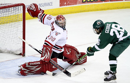 Nebraska-Omaha goalie John Faulkner stops Bemidji State's Jordan George during a breakaway in the second period. Bemidji State beat UNO 3-2 Saturday night at Qwest Center Omaha to win the best-of-three WCHA first-round series. (Photo by Michelle Bishop) (Michelle Bishop)