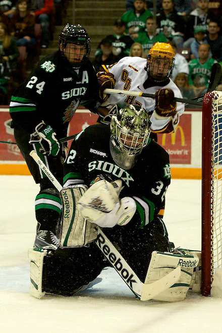 6 Nov 11: Ben Blood (North Dakota 24), Aaron Dell (North Dakota - 32), Erik Haula (Minnesota - 19) The University of Minnesota Golden Gophers host the University of North Dakota Fighting Sioux in a WCHA matchup at Mariucci Arena in Minneapolis, MN. (Jim Rosvold)