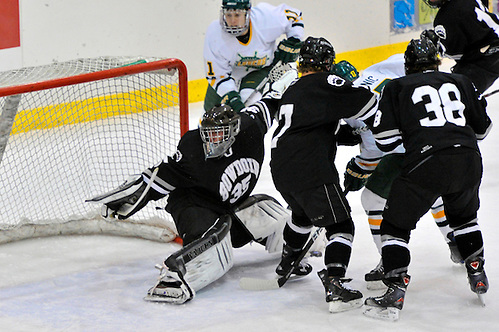 2011 DIII Bowdoin vs Oswego; The Bowdoin goalie #35 Steve Massina lost sight of the puck as it lies at his feet - Copyright 2011 Angelo Lisuzzo (Angelo Lisuzzo)