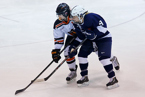 Denna Laing (Princeton - 14) and Amy Petersen (Penn State - 9) battle for position at center ice. (Shelley M. Szwast)