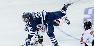 John Hayden (Yale - 21) and Garrett Skrbich (Princeton - 17) battle in the neutral zone. (Shelley M. Szwast)