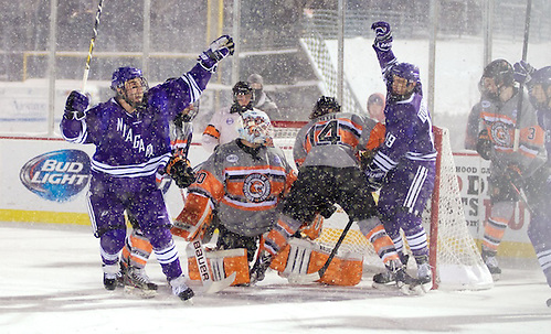 TJ Sarcona (21, left), Hugo Turcotte (19) - RIT and Niagara skated to a 2-2 tie at the Frozen Frontier, an outdoor hockey event in Rochester, NY. (Omar Phillips)