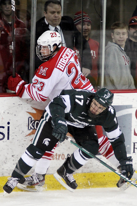 10 Mar 12: Matt Crandell (MSU - 17), Alden Hirschfeld (Miami - 23) Miami University sweeps Michigan State University at Steve Cady Arena in Oxford, OH in Round 2 of the CCHA Playoffs to advance to the semi-finals in Detroit. (©Rachel Lewis)