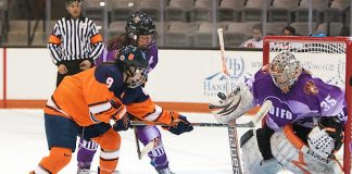 Jetta Rackleff (35 - RIT) makes one of her 41 saves in front of Stephanie Grossi (8 - Syracuse) and Carly Payerl (17 - RIT) (Omar Phillips)