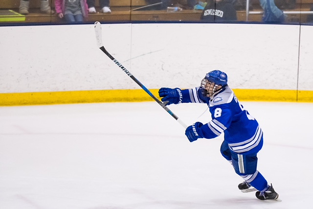 Justin Grillo #8 of Colby Mules celebrates scoring the game winning goal with 1.6 seconds remaining in the third period against the Geneseo Knights at the NCAA Division III men's ice hockey Tournament Second-Round between the Geneseo Knights and the Colby Mules on March 17, 2018. Collby defeats Geneseo 2-1. Photograph by Brett Carlsen for Colby College. (Brett Carlsen)