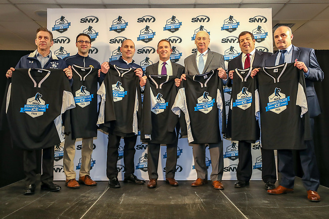 Pictured from today's press conference are, from left, Keith Allain (Yale head coach), Bill Riga (Quinnipiac associate head coach), Mike Cavanaugh (UConn head coach), Steve Raab (SNY president), Thomas Gill (city of Bridgeport), Tom Regan (Connecticut Hockey Conference/USA Hockey) and C.J. Marottolo (Sacred Heart head coach). (photo: John McCreary) (Tim Brule)