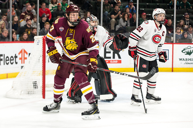 Riley Tufte  (Minnesota-Duluth-27 David Hrenak (SCSU-34) 2019 March 23 University of Minnesota Duluth and St. Cloud State University meet in the championship game of the NCHC  Frozen Face Off at the Xcel Energy Center in St. Paul, MN (Bradley K. Olson)