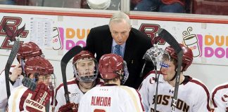 Jerry York (BC - Head Coach) speaks to Barry Almeida (BC - 9) during a break in action. - The Boston College Eagles defeated the Merrimack College Warriors 4-2 to give Head Coach Jerry York his 900th collegiate win on Friday, February 17, 2012, at Kelley Rink at Conte Forum in Chestnut Hill, Massachusetts. (Melissa Wade)