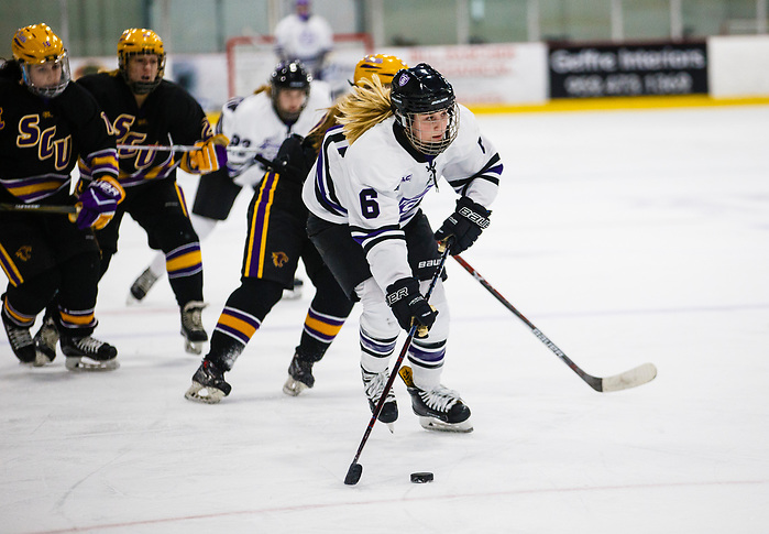 Maddy Fiedler takes the puck down the ice. (Mike Ekern/University of St. Thomas)